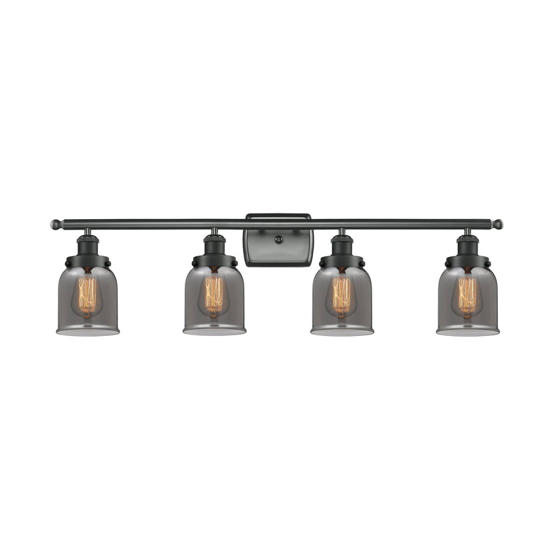 Bell Bath Vanity Light shown in the Matte Black finish with a Plated Smoke shade