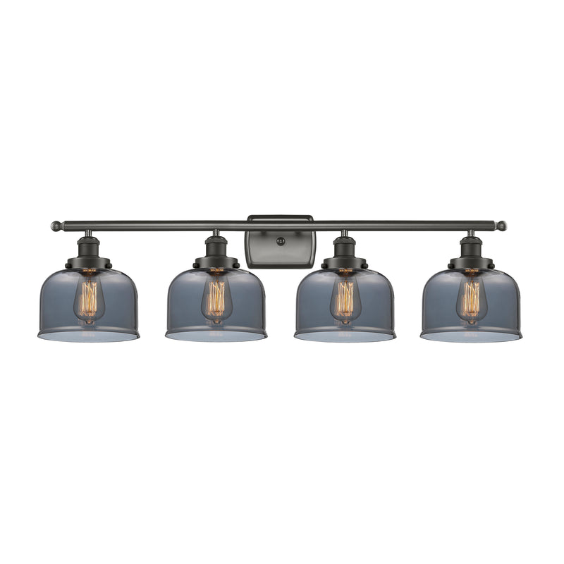 Bell Bath Vanity Light shown in the Oil Rubbed Bronze finish with a Plated Smoke shade